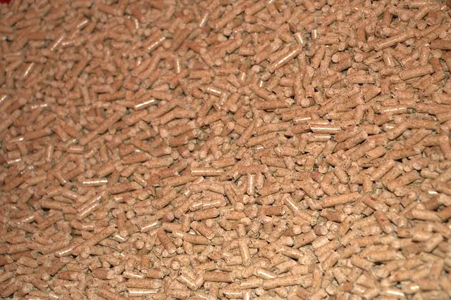 Close-up pile of compressed pine wood biomass pellets